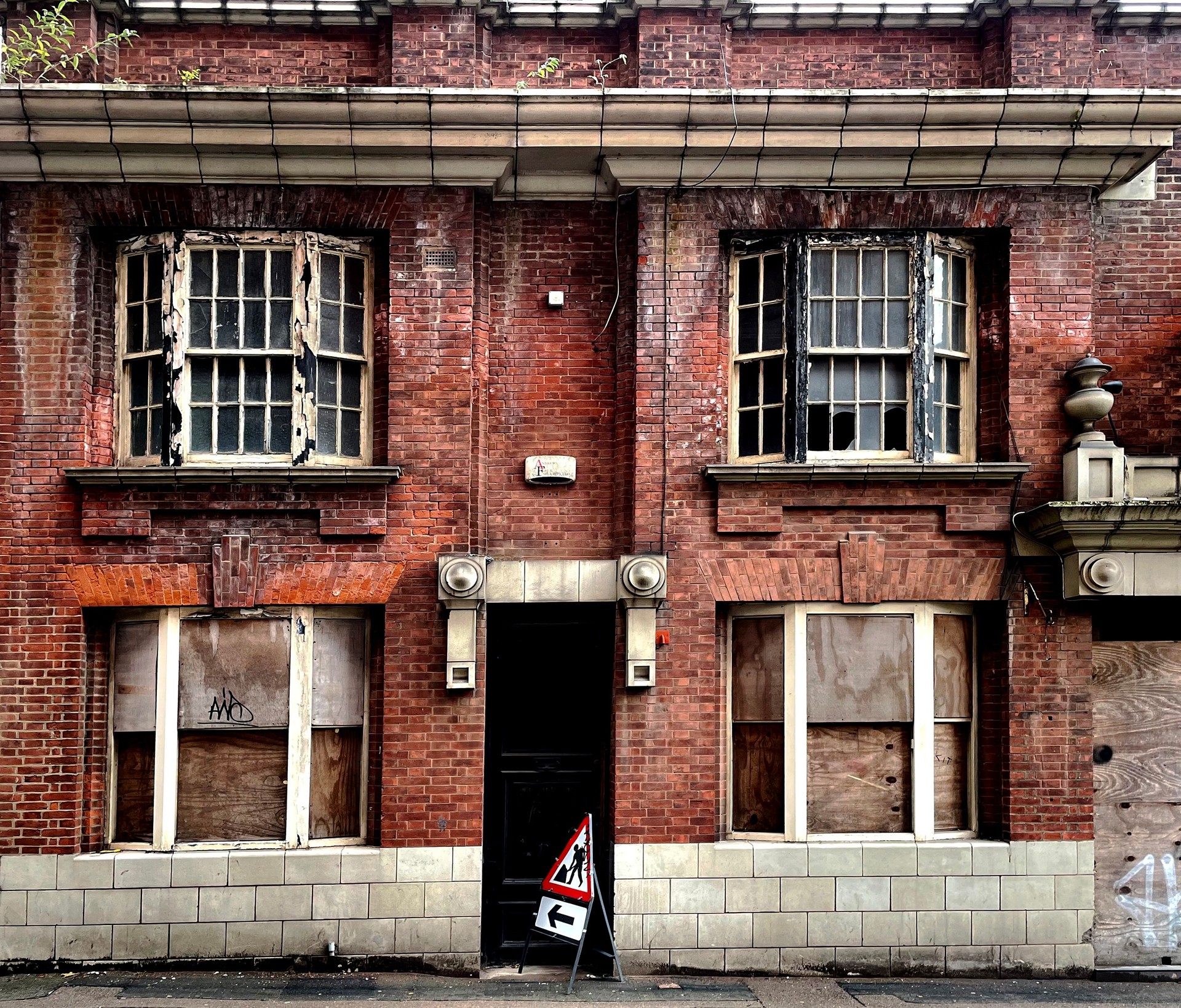 Broken windows in a derelict pub